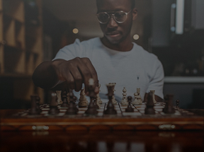 A person deep in thought, contemplating their next move