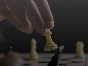 A person knocking over a knight with their bishop